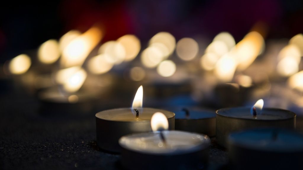 A close up of a tea candle at a vigil